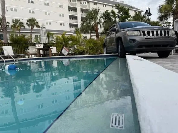 jeep almost falls in pool