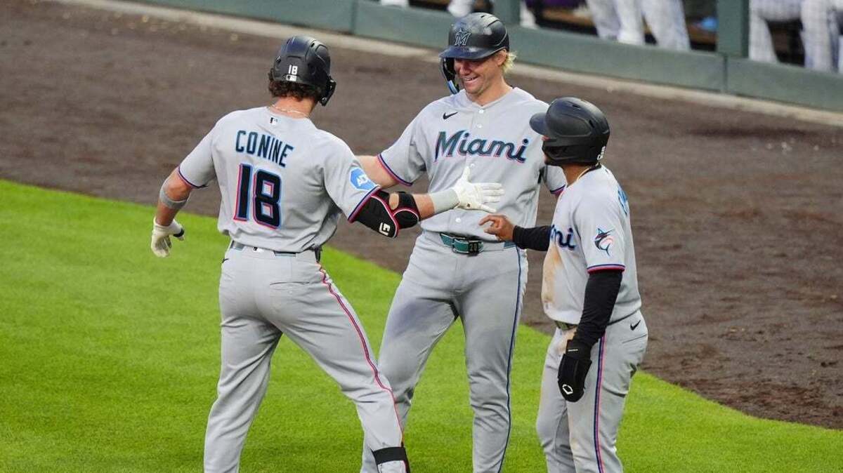 Lopez, Conine power Marlins to 10-7 win