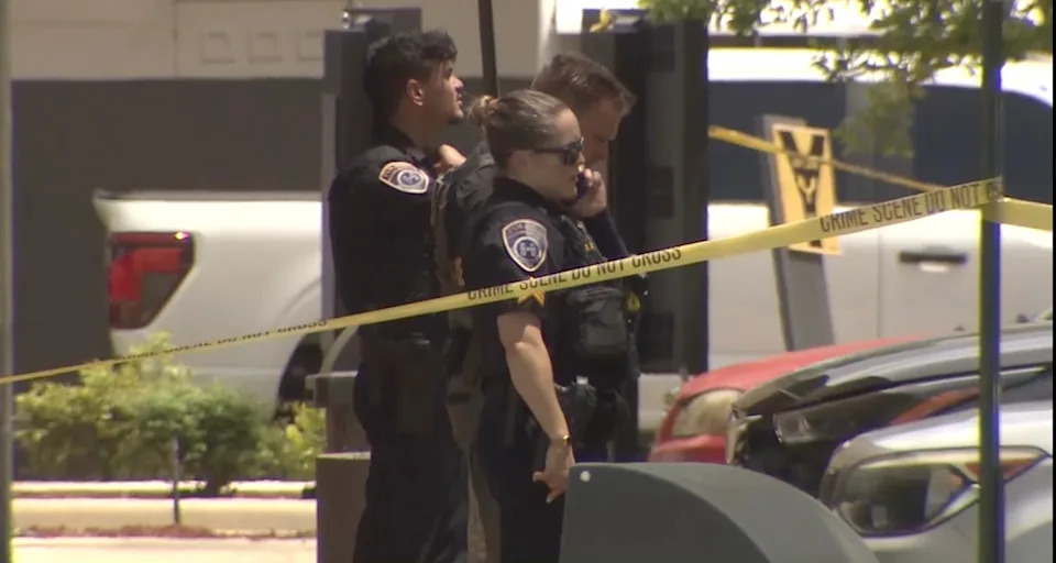 WSVN - PHOTO: Police investigate a shooting, June 27, 2026, outside a McDonald's in Hallandale Beach, Florida, that injured a man and his 11-year-old daughter who were caught in the crossfire, police said.