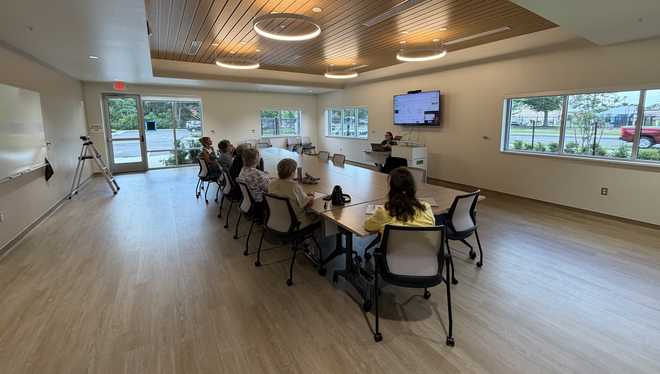 Meeting room being used by a group. Meeting room being used by a group.