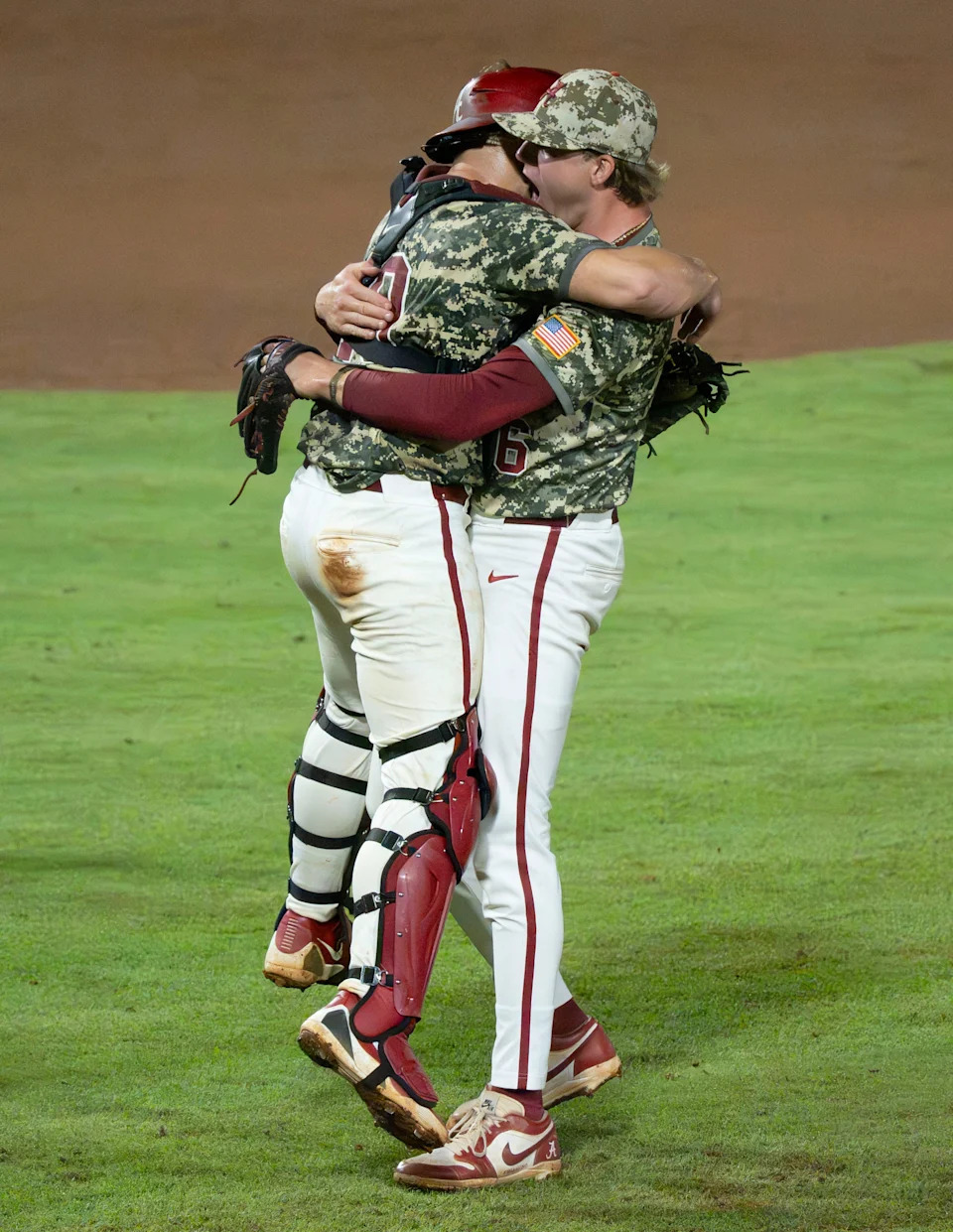 May 31, 2026; Tuscaloosa, AL, USA; Alabama's Brady Neal (10) and Alabama pitcher Hagan Banks (36) celebrate after the final out in the Tuscaloosa NCAA Regional in the championship series between Oklahoma State and Alabama. Alabama won 9-7 in 11 innings.