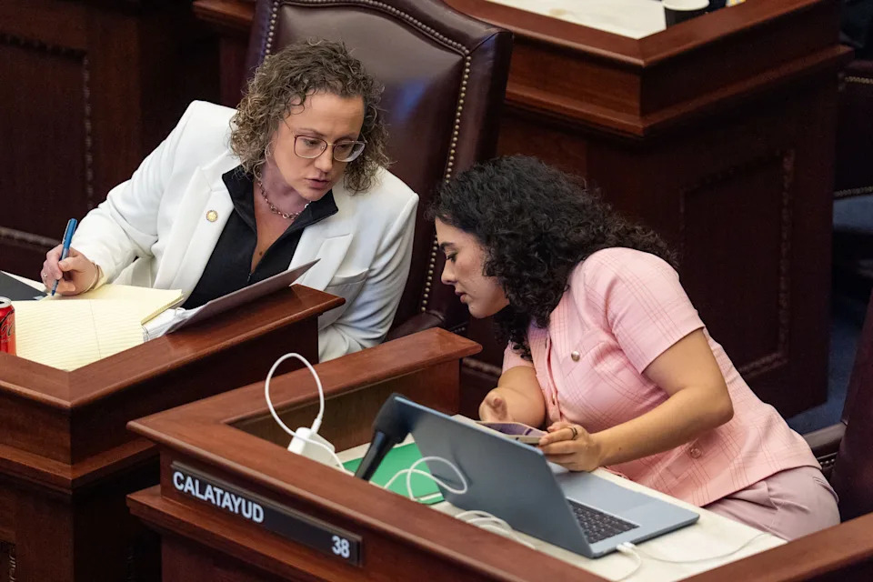 Sen. Erin Grall, left, whispers to Sen. Alexis Calatayud during a special session called to discuss property taxes Tuesday, June 2, 2026.