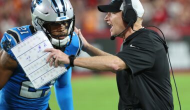 Dec 3, 2023; Tampa, Florida, USA; Carolina Panthers interim head coach Chris Tabor talks with safety Jeremy Chinn (21) against the Tampa Bay Buccaneers during the second half at Raymond James Stadium. Mandatory Credit: Kim Klement Neitzel-USA TODAY Sports