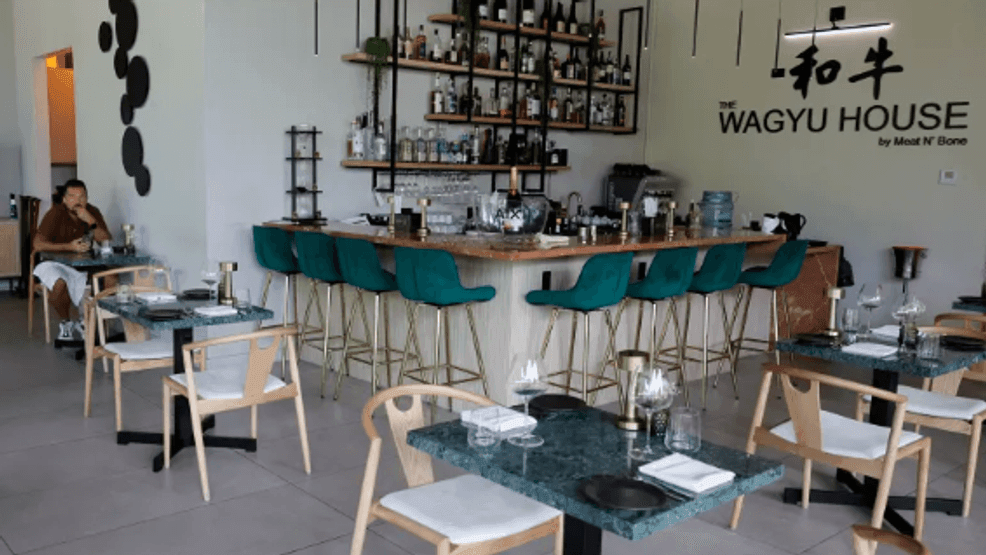 The dining room of the Wagyu House in Hallandale Beach is shown on Tuesday, June 23, 2026. Starting July 1, Florida's new “Operations Charge” law mandates that all restaurants clearly label their automatic gratuities (credit card fees, delivery fees, split-plate fees) on printed menus, websites and bills. (Amy Beth Bennett / South Florida Sun Sentinel)