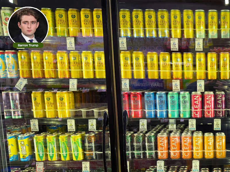 Barron Trump and grocery fridge containing cans of yerba mate and energy drinks.