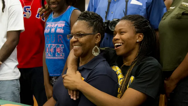 Dunbar High School basketball student Keri Jewett smiles alongside her grandmother Evelyn Williams after signing a National Letter of Intent to the University of Southern Mississippi Monday afternoon. Dunbar High School  basketball student Kiara Desamours signed a National Letter of Intent to Lamar University in Texas.