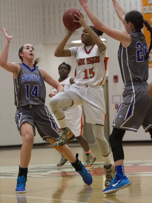 Dunbar's Dekeriya Patterson takes a shot against Georgetown in the Queen of Palms Ruby Division on Tuesday night, December 30, 2014, at Dunbar High School in Fort Myers.