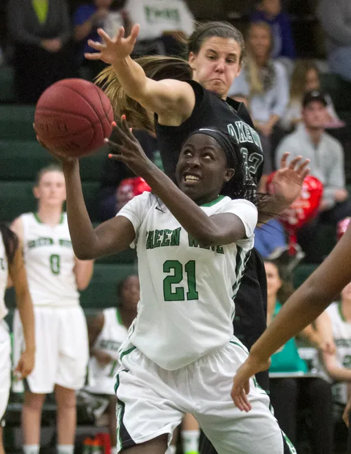 Autumn Giles of Fort Myers is guarded by Lakewood Ranch's Kyra Klarkowski as she goes up for a shot in the girls regional basketball finals on Saturday, February 14, 2015, at Fort Myers High School.