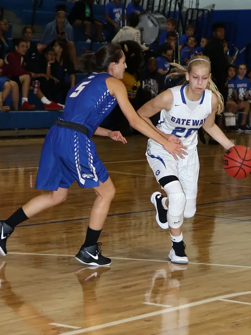 Gateway eight-grader Addison Potts drives to the basket in a game against Oasis.
