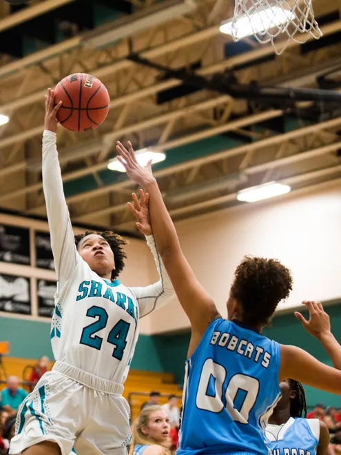 Gulf Coast junior, Yasmeen Chang, goes up for a shot during the class 8A regional quarterfinal against   North Port High School on Tuesday, February 20, 2018 at Gulf Coast High School.