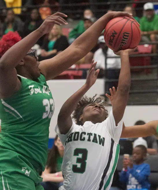 Fort Myers High School's Chaniya Clark (33) blocks a shot by Choctawhatchee's Ataliya Brown (3) during the first half of their FHSAA Girls 7-A Championship game at The RP Funding Center in Lakeland Saturday. Fort Myers won 65-41. March 3, 2018. (SPECIAL TO THE NEWS PRESS/MICHAEL WILSON)