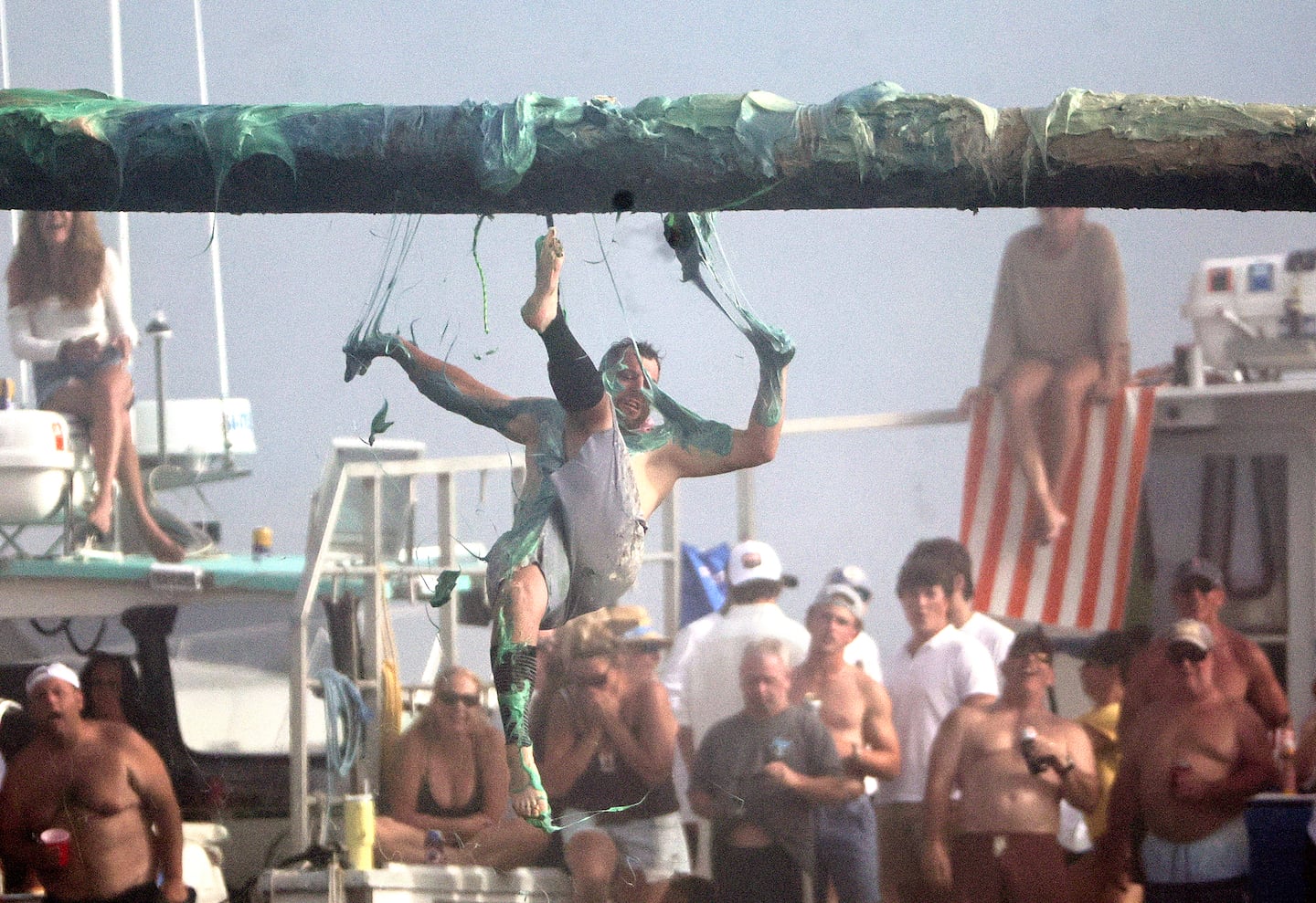 Joe DaSilva falls off during the Greasy Pole Contest at Pavilion Beach on June 29, 2025.