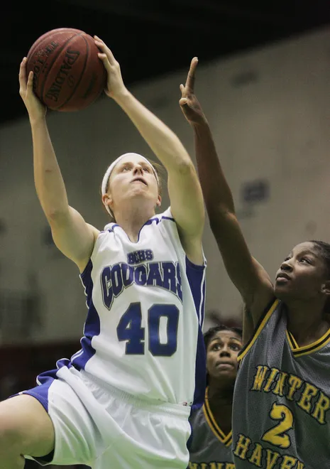 Kelsey Assarian shoots, a 2008 Barron Collier High graduate, helped lead the Cougars to the 2008 Class 5A state championship and was named tournament MVP. She made first team all-state as a senior, leading the Cougars in scoring, rebounds, blocks and steals and was a Street & Smith’s Honorable Mention All-American.  A two-time News-Press Basketball Player of the Year, she also started for Barron Collier’s 2006 state title team. Assarian played four seasons at Texas A&M.