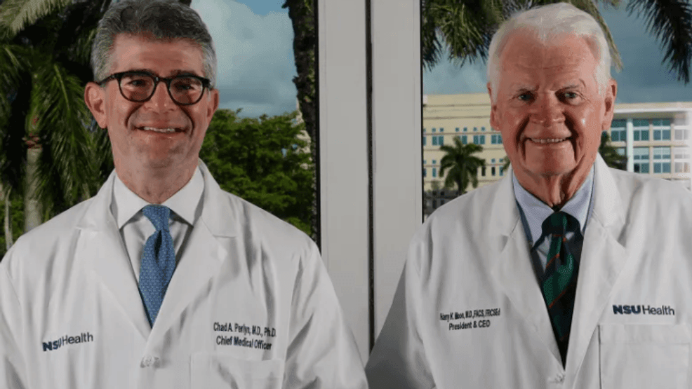 Dr. Chad Perlyn, executive vice president and chief medical officer, left, and Dr. Harry Moon, president of Nova Southeastern University, in the boardroom on the Davie campus. Perlyn sees big donations transforming healthcare. (Joe Cavaretta/South Florida Sun Sentinel file)