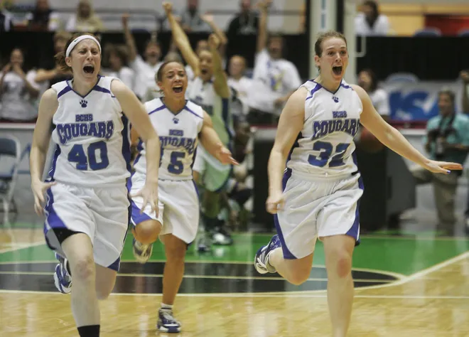 Barron Collier teammates Kelsey Assarian, Saphira Philson and Erin Zampell celebrate after beating Winter Haven for the Class 5A girls state basketball championship at the Lakeland Center on Friday February 22, 2008. Barron Collier won 33-30.