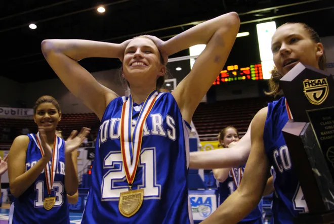 Barron Collier's Courtney Jacob relishes the moment as she is announced as the MVP of the tournament in Class 5A after Barron Collier defeated Winter Haven 43-36 to win the state championship in Lakeland on Friday, Feb. 24, 2006.