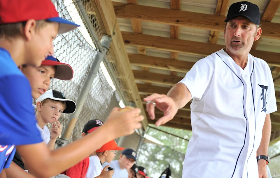 Longtime Stuart resident and former major league pitcher Rusty Meacham shows Mark Bartolotta, 13, the proper pitching grip during his summer baseball camp Wednesday morning June 27, 2012, at Wojcieszak Park in Port Salerno. The camp was organized by the Port Salerno Little League and included instruction from several former major league players.