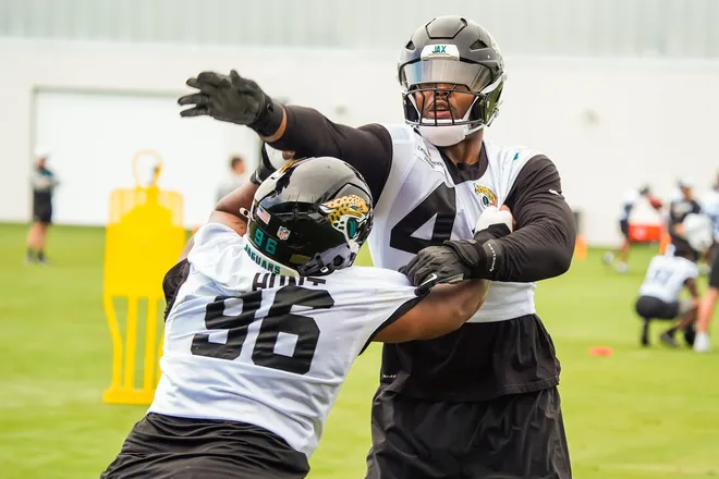 Jacksonville Jaguars defensive end Travon Walker (44) runs drills with teammate defensive tackle Jalen Hunt during the second day of minicamp at the Miller Electric Center, Wednesday, June 10, 2026, in Jacksonville. [Doug Engle/Florida Times-Union]