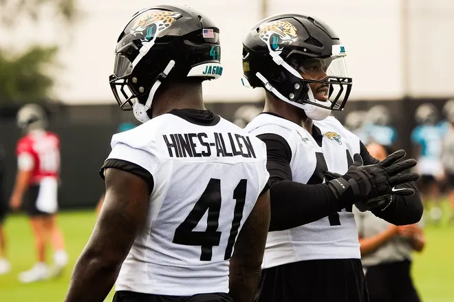 Jacksonville Jaguars defensive end Josh Hines-Allen (41) and Jacksonville Jaguars defensive end Travon Walker (44) talk during the second day of minicamp at the Miller Electric Center, Wednesday, June 10, 2026, in Jacksonville. [Doug Engle/Florida Times-Union]