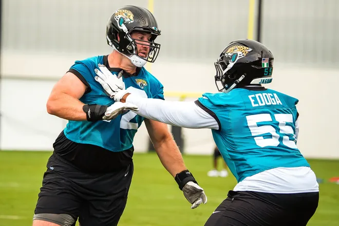 Jacksonville Jaguars offensive tackle Walker Little (72) runs a blocking drill with Jacksonville Jaguars guard Chuma Edoga (55) during the second day of minicamp at the Miller Electric Center, Wednesday, June 10, 2026, in Jacksonville. [Doug Engle/Florida Times-Union]