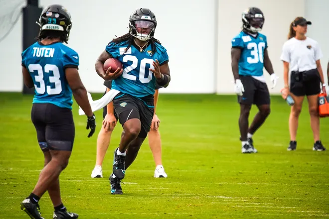 Jacksonville Jaguars running back Deejay Dallas (20) runs the ball during the second day of minicamp at the Miller Electric Center, Wednesday, June 10, 2026, in Jacksonville. [Doug Engle/Florida Times-Union]
