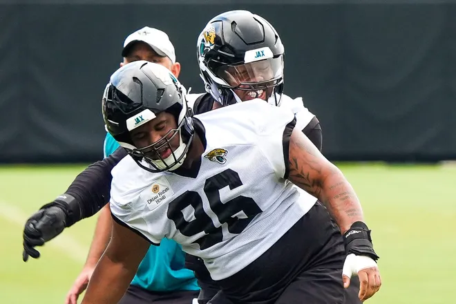 Jacksonville Jaguars defensive end Travon Walker (44) runs drills with teammate defensive tackle Jalen Hunt during the second day of minicamp at the Miller Electric Center, Wednesday, June 10, 2026, in Jacksonville. [Doug Engle/Florida Times-Union]