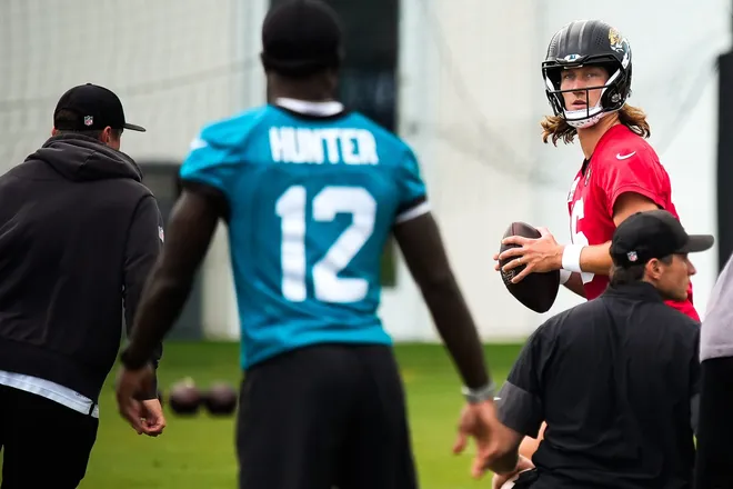 Jacksonville Jaguars quarterback Trevor Lawrence (16) looks to pass the ball to Jacksonville Jaguars wide receiver Travis Hunter (12) during the second day of minicamp at the Miller Electric Center, Wednesday, June 10, 2026, in Jacksonville. [Doug Engle/Florida Times-Union]