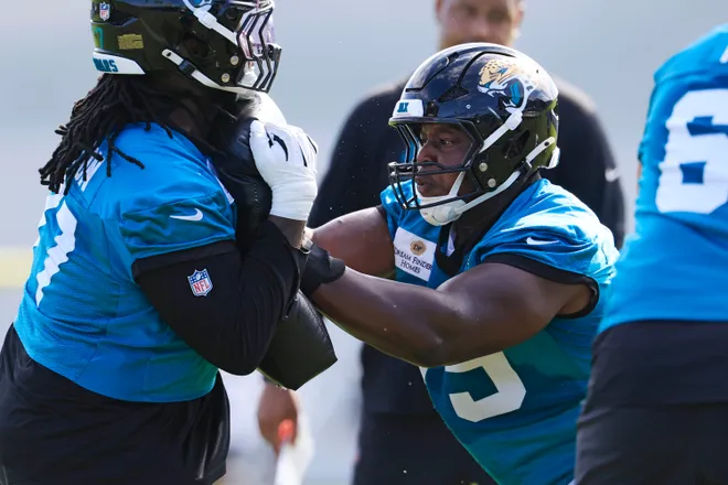 Jacksonville Jaguars offensive lineman Emmanuel Pregnon (75), right, drills on offensive tackle Anton Harrison (77) during the third day of minicamp at the Miller Electric Center, Thursday, June 11, 2026, in Jacksonville, Fla.