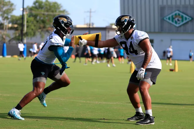Jacksonville Jaguars defensive end Josh Hines-Allen (41) drills on defensive lineman T.J. Bollers (94) during the third day of minicamp at the Miller Electric Center, Thursday, June 11, 2026, in Jacksonville, Fla.