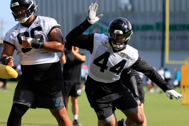 Jacksonville Jaguars defensive end Travon Walker (44) drills on defensive lineman Jalen Hunt (96) during the third day of minicamp at the Miller Electric Center, Thursday, June 11, 2026, in Jacksonville, Fla.