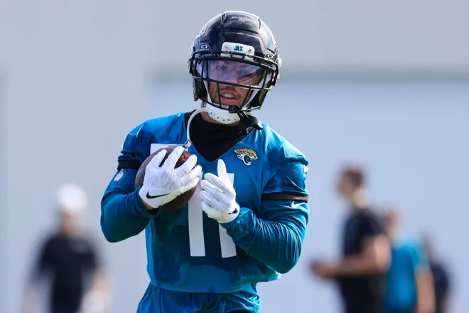 Jacksonville Jaguars wide receiver Parker Washington (11) runs the ball during the third day of minicamp at the Miller Electric Center, Thursday, June 11, 2026, in Jacksonville, Fla.