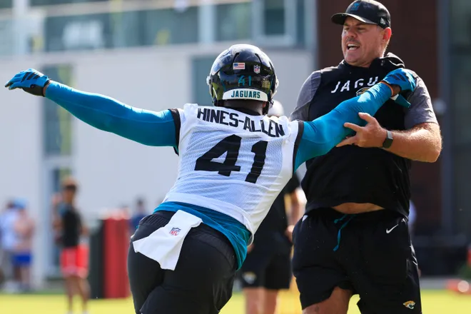 Jacksonville Jaguars defensive end Josh Hines-Allen (41) drills on defensive line coach Matt Edwards during the third day of minicamp at the Miller Electric Center, Thursday, June 11, 2026, in Jacksonville, Fla.