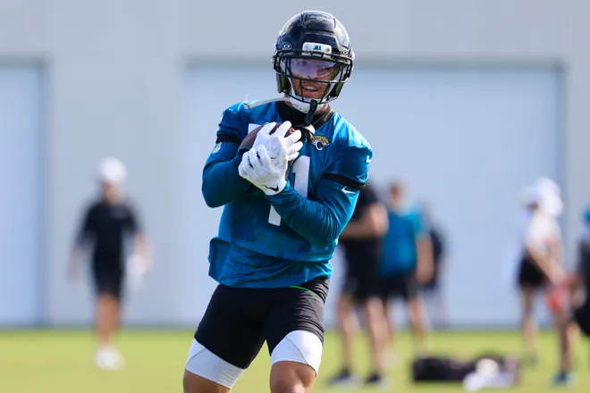 Jacksonville Jaguars wide receiver Parker Washington (11) runs the ball during the third day of minicamp at the Miller Electric Center, Thursday, June 11, 2026, in Jacksonville, Fla.