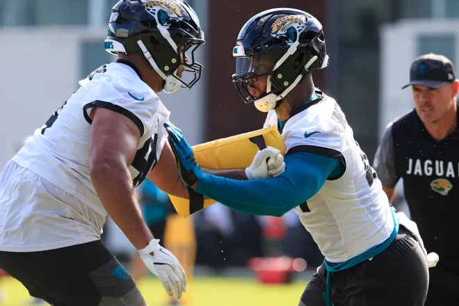Jacksonville Jaguars defensive end Josh Hines-Allen (41), right, drills on defensive lineman T.J. Bollers (94) during the third day of minicamp at the Miller Electric Center, Thursday, June 11, 2026, in Jacksonville, Fla.