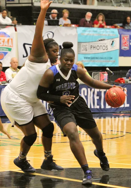 Naples Community School forward Stephanie Paul heads for the basket as Jacksonville University Christian's Norman Tarje tries to block during the FHSAA Girls 3A semifinals Tuesday February 16, 2016 in Lakeland, Florida.