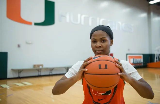 Michelle Woods, 21, a point guard for the University of Miami Women's basketball team, poses for a photo at the Fieldhouse training facility on UM's campus on Monday, Oct. 13, 2014.