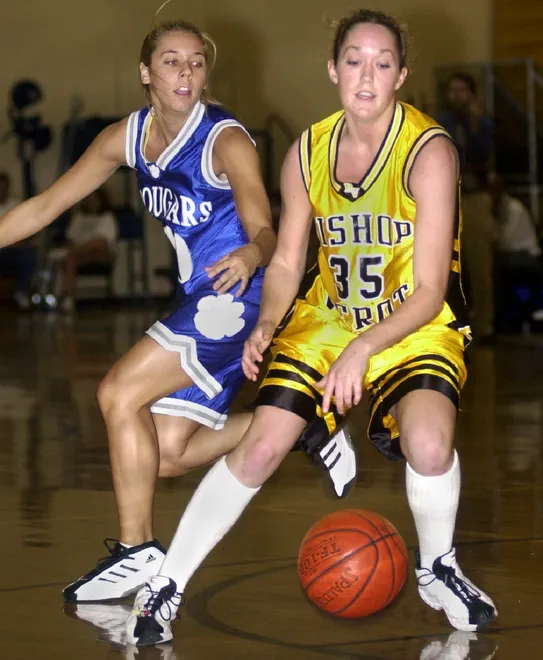 Bishop Verot senior Christen Spake (#35) dribbles past a Barron Collier defender during their game on Wednesday, Nov. 22, 2001.