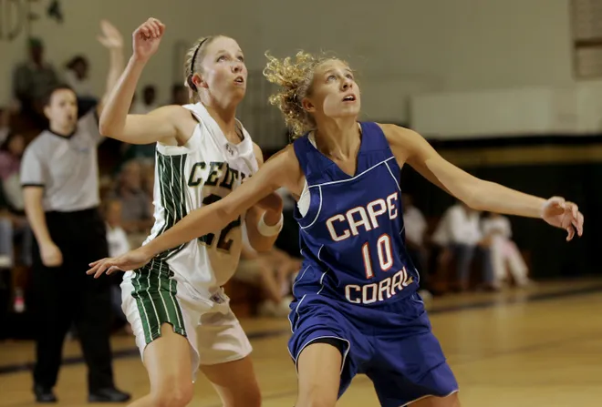 St John Neumann's Sarah Wickham, left, and Cape Coral's Alexiss Griffin battle for a rebound
during a recent game in Naples on Thursday Nov. 15, 2007.