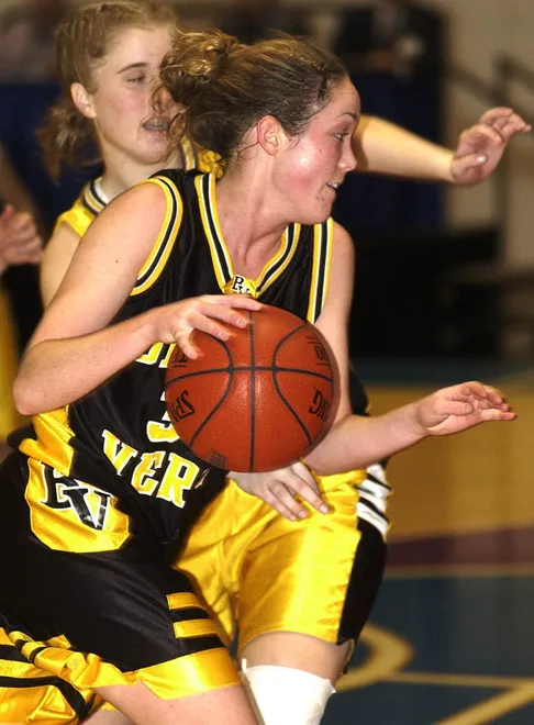 Christen Spake drives to the net during the Class 3A girls state semifinal against Bishop Moore in Lakeland on Feb. 28, 2002.