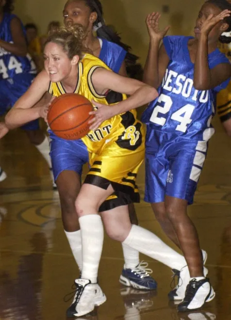 Bishop Verot's Christen Spake escapes DeSoto's Gavonia Wiley (#24) during the regional quarter final game at Bishop Verot on Feb. 15, 2002.