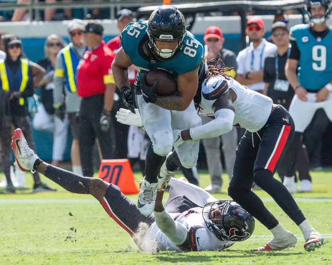 Jacksonville Jaguars tight end Brenton Strange (85) leaps over a defender during the fourth quarter between the Houston Texans and the Jacksonville Jaguars Sunday September 21, 2025 at EverBank Stadium in Jacksonville, Fla. The Jaguars defeated the Texans 17-10. [Doug Engle/Florida Times-Union]