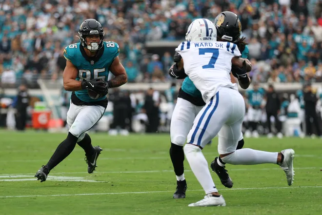 Dec 7, 2025; Jacksonville, Florida, USA; Jacksonville Jaguars tight end Brenton Strange (85) runs after the catch as Indianapolis Colts cornerback Charvarius Ward (7) pursues during the first half at EverBank Stadium. Mandatory Credit: Matt Pendleton-Imagn Images