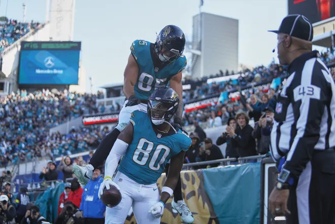 Jan 4, 2026; Jacksonville, Florida, USA; Jacksonville Jaguars tight end Quintin Morris (80) celebrates with tight end Brenton Strange (85) after scoring a touchdown against the Tennessee Titans during the second quarter at EverBank Stadium. Mandatory Credit: Morgan Tencza-Imagn Images