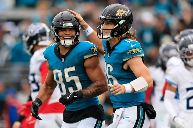 Jacksonville Jaguars tight end Brenton Strange (85) is congratulated by quarterback Trevor Lawrence (16) during the second quarter of an NFL football matchup at EverBank Stadium, Sunday, Jan. 4, 2026, in Jacksonville, Fla. [Corey Perrine/Florida Times-Union]