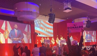 Supporters cheer as Rep. Byron Donalds, the leading GOP candidate in Florida's gubernatorial race, takes the stage at the Florida Republican Party's Sunshine State Showdown at the Seminole Hard Rock Hotel & Casino. (Samantha Putterman/PolitiFact)