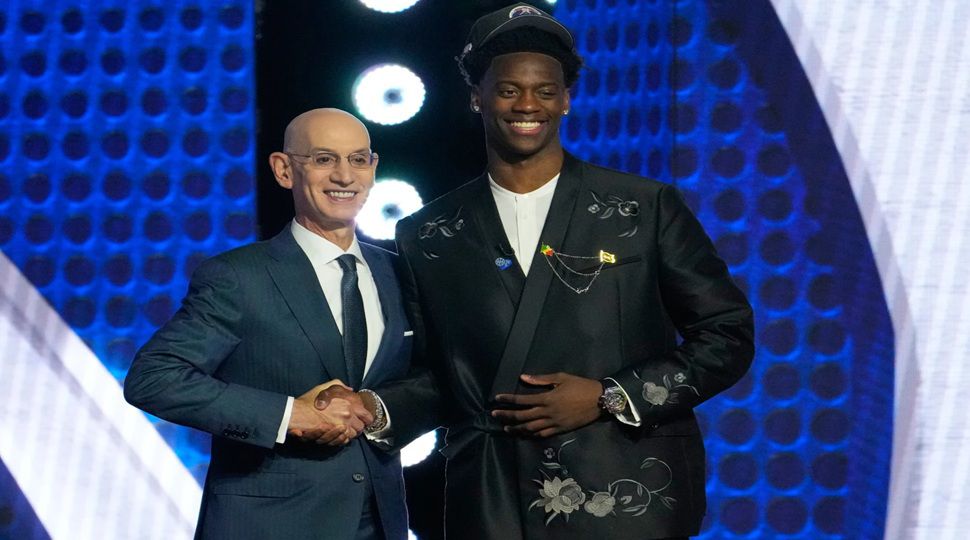 AJ Dybantsa, right, poses for a photo with NBA commissioner Adam Silver, left, after being selected by the Washington Wizards as the first pick in the first round of the NBA basketball draft, Tuesday, June 23, 2026, in New York. (AP Photo/Yuki Iwamura)