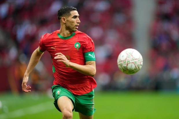 Morocco's Achraf Hakimi runs with the ball during the Africa Cup of Nations round of 16 soccer match between Morocco and Tanzania in Rabat, Morocco, Sunday, Jan. 4, 2026. (AP Photo/Mosa'ab Elshamy)