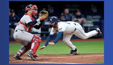 Tampa Bay Rays' Ryan Vilade, right, scores ahead of the throw to Boston Red Sox catcher Mickey Gasper on an RBI single by Cedric Mullins during the fourth inning of a baseball game Tuesday, June 9, 2026, in St. Petersburg, Fla. (AP Photo/Chris O'Meara)