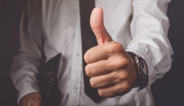 Businessman gesturing thumbs up sign