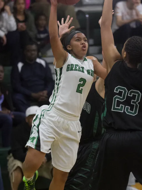 Jarya Outten of Fort Myers takes a shot over LaDazhia Williams of Lakewood Ranch in the girls regional basketball finals on Saturday, February 14, 2015, at Fort Myers High School.